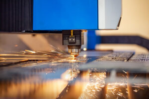 CNC Laser cutting of metal modern industrial technology. Laser cutting works by directing the output of a high-power laser through optics. Laser optics and CNC computer numerical control.