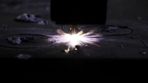 Cutting metal with a laser. Clip . Cutting of CNS iron with a laser in production