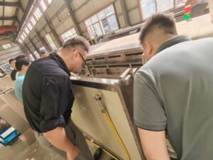 An image of a technician cleaning titanium anodes using a specialized cleaning solution or performing light maintenance on anodes, with a clear focus on the process of restoring performance.