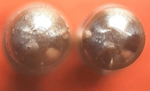 Close-up photo of a titanium component showing controlled surface texture and deburred edges, highlighting coating-ready Ra finish for MMO and platinum titanium anodes.