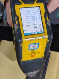 This close-up photograph shows a digital pinhole inspection device testing the coating integrity of expanded titanium mesh used in MMO and precious-metal-coated anodes. The image highlights essential QC steps within the coating process window, including pinhole detection, spark thresholds, and zone-based inspection to ensure uniform coating performance and long service life. Ideal for technical pages about titanium anodes, MMO coating quality control, and electrode manufacturing processes.