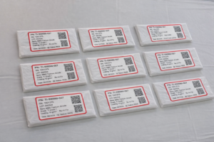 To protect the precious-metal coating, labels are never applied directly to the anode surface. As shown in the image, each titanium anode is fully wrapped with clean protective paper, and the identification label is attached to the outer packaging layer, not the coated component itself.